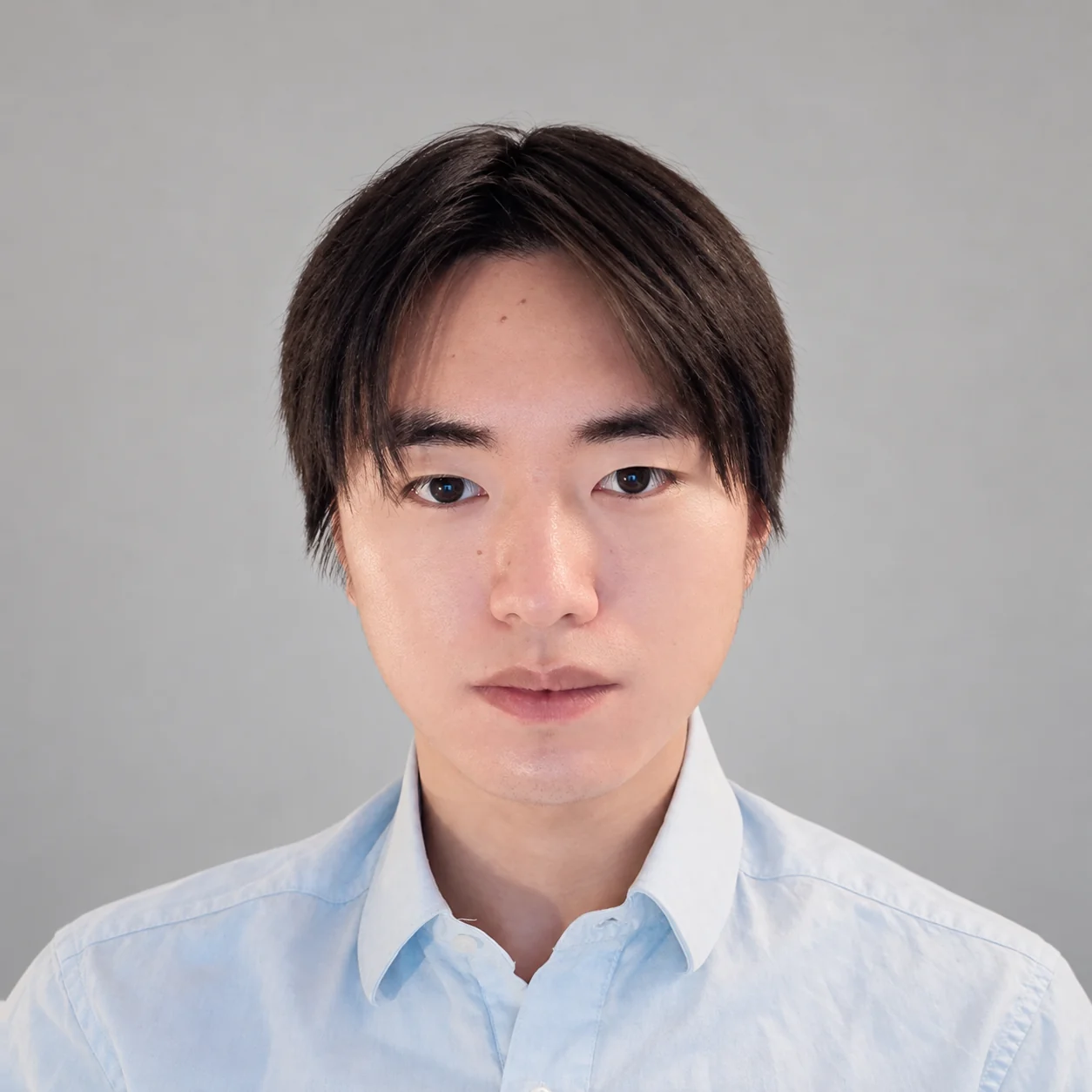 Portrait of Kecheng Shi in a light blue shirt